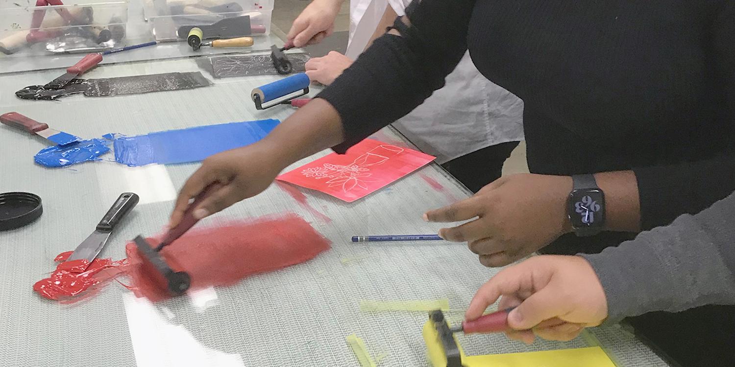 Students rolling ink for printing